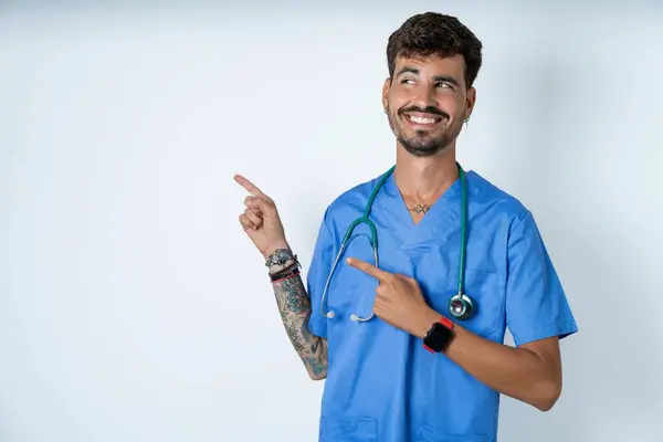 Optimistic Handsome Nurse Man Wearing Surgeon Uniform White Background Points — Stock Photo, Image