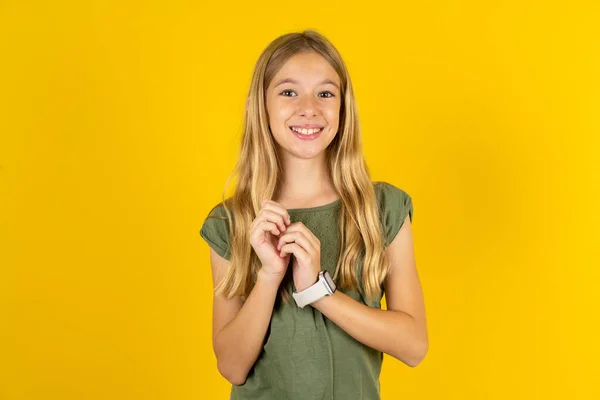 Positive Blond Little Girl Wearing Khaki Blouse Yellow Background Smiles — Stock Photo, Image