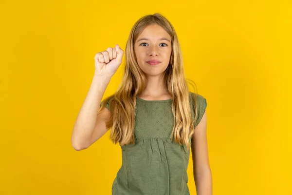 Blond Little Girl Wearing Khaki Blouse Yellow Background Pointing Fingers — Stock Photo, Image