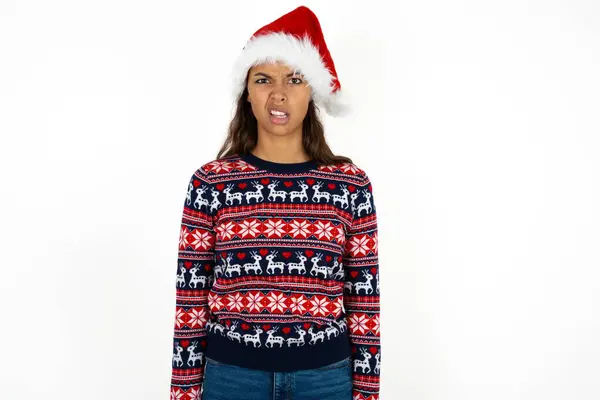 Portrait Dissatisfied Beautiful Hispanic Woman Wearing Knitted Sweater Santa Claus — Stock Photo, Image