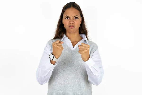 Displeased Annoyed Young Beautiful Hispanic Woman White Background Clenches Fists — Stock Photo, Image