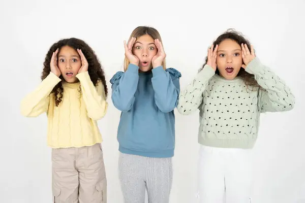 Three Young Beautiful Multiracial Kid Girls Scared Expression Keeps Hands — Stock Photo, Image