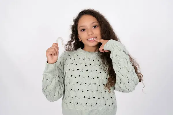 Beautiful Kid Girl Wearing Sweater Holding Invisible Aligner Pointing Perfect — Stock Photo, Image