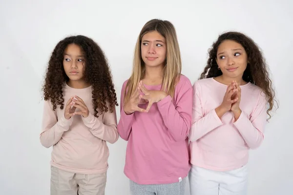 Three Young Beautiful Multiracial Kid Girls Steepled Fingers Looks Mysterious — Stock Photo, Image