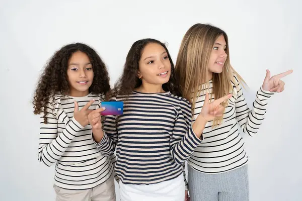 Curious Smiling Three Young Beautiful Multiracial Kid Girls Showing Plastic — Stock Photo, Image