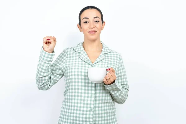 Beautiful Young Woman Wearing Green Plaid Pyjama Holding Cup Pointing — Stock Photo, Image