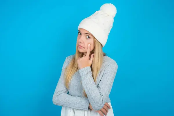 Beautiful Kid Girl Wearing White Knitted Hat Blue Sweater Pointing — Stock Photo, Image