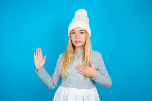 Beautiful Kid Girl Wearing White Knitted Hat Blue Sweater Swearing — Stock Photo, Image