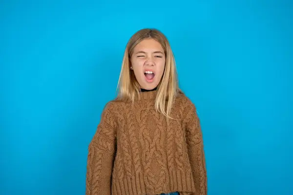 Beautiful Kid Girl Wearing Brown Knitted Sweater Yawns Opened Mouth — Stock Photo, Image