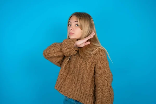 Beautiful Kid Girl Wearing Brown Knitted Sweater Cutting Throat Hand — Stock Photo, Image