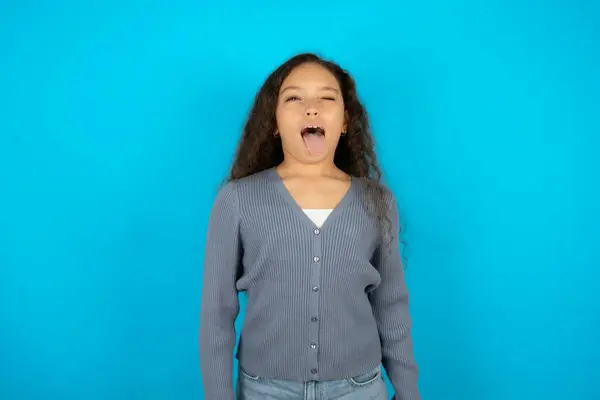 Beautiful Kid Girl Wearing Casual Jacket Blue Background Sticking Tongue — Stock Photo, Image