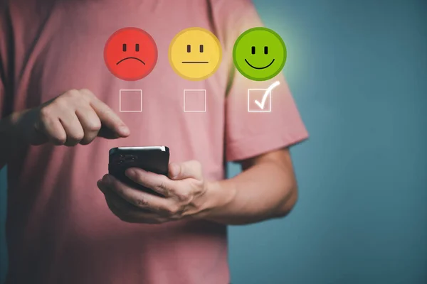 stock image Customer service and Satisfaction survey concept ,Business people are touching the virtual screen on the happy Smiling face icon to give satisfaction in service. rating very impressed