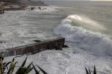 Rough sea on the pier of Genoa Quinto, Italy