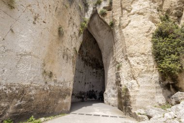 SYRACUSE, ITALY, JUNE 21, 2023 - The ear of Dionysus in Neapolis of Syracuse Archaeological Park, Sicily, Italy clipart