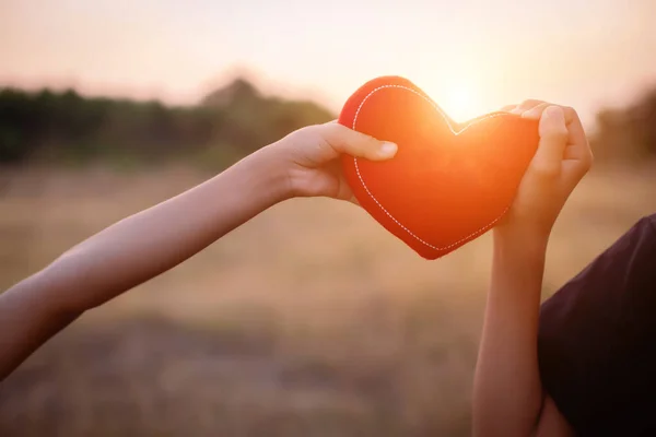 stock image boy hands holding hearts silhouette