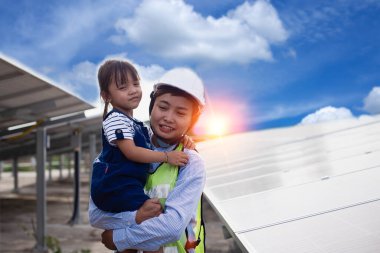 mather and daughter by solar panels clipart