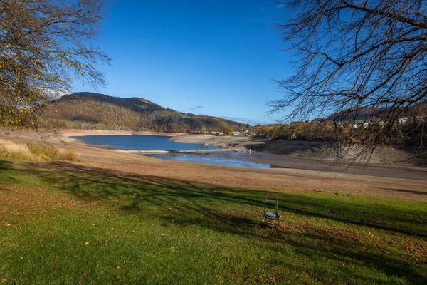 stock image Lake Diemelsee a large lake in the nature reserve Diemelsee, area Sauerland. An almost dried up lake in autumn time