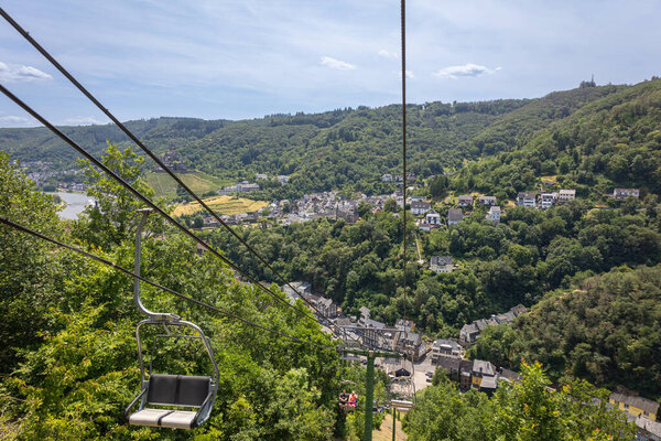 View from the cable car of the river Moselle, the castle of the Reichsburg and the German town of Cochem on the river