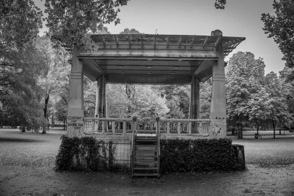 An old stage for local artists in the northern park of the capital Groningen on a cold autumn day, photo taken in black and white
