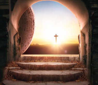 Easter and Good Friday concept, Empty tombstone with cross on mountain sunrise background clipart