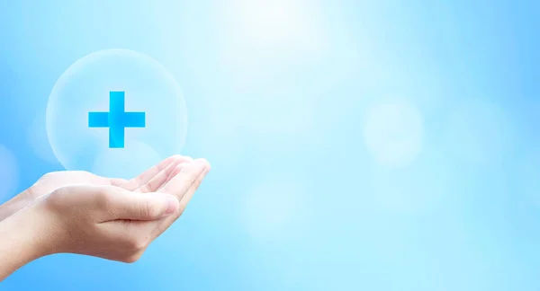 World Health Day, hold virtual plus medical network connection icons on blue background.