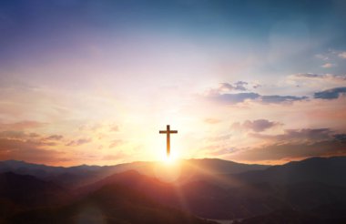 Silhouette of Jesus with Cross over calvary sunset background clipart