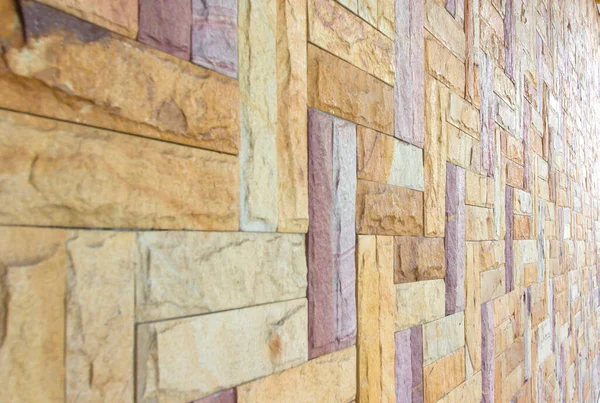 斜めの角度で石壁モザイクの背景 — ストック写真
