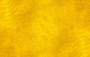 Altın metal fırçalanmış arka plan veya fırçalanmış çelik dokusu