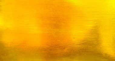 Altın metal fırçalanmış arka plan veya fırçalanmış çelik dokusu