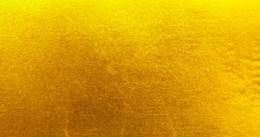 Altın metal fırçalanmış arka plan veya fırçalanmış çelik dokusu