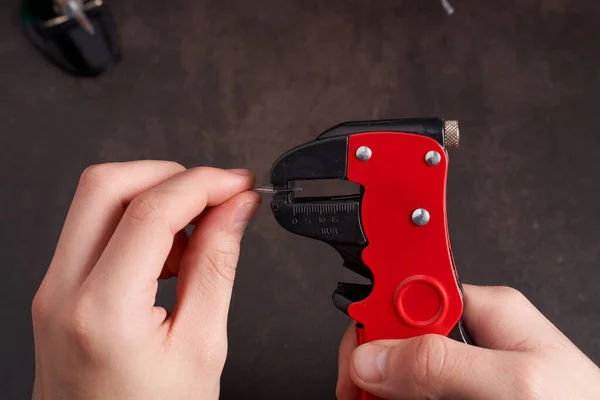 man stripping cable with cable stripper. High quality photo