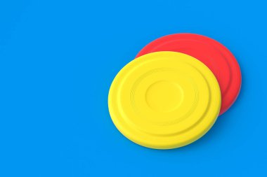 Two frisbee discs on blue background. Summertime vacation. Toy for game on beach. Summer leisure. Copy space. 3d render