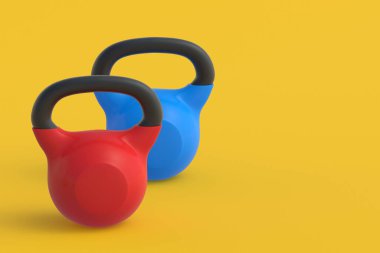 Sarı arka planda kettlebell 'ler. Spor malzemeleri. Güç kaldırma eğitimi. Antrenman egzersizleri. Sağlıklı bir yaşam tarzı. Uzayı kopyala 3d hazırlayıcı