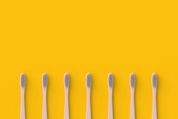Row Toothbrushes Orange Background Accessory Hygiene Healthcare Top View Copy — Stock Photo, Image