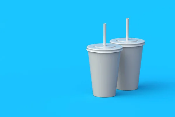 Two disposable cups for beverages with straw. Plastic or paper package for soda drink. Cinema accessories. Copy space. 3d render