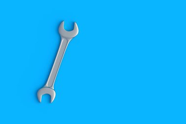 Mavi arka planda bir anahtar. Atölyede ingiliz anahtarı. Tamir ve bakım aletleri. Üst Manzara. Uzayı kopyala 3d hazırlayıcı