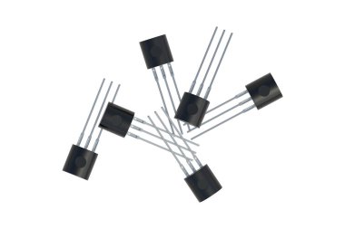 Scattered transistors isolated on white background. Electronic component. Part of electrical circuit. Top view. 3d render clipart