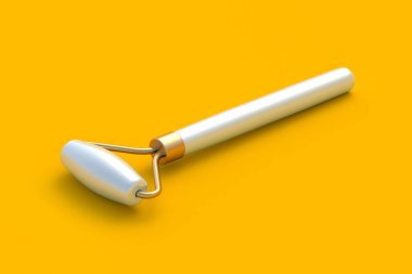 Sarı arka planda yüz masajı silindiri. Yüzü kaldırma aleti. Kozmetik aksesuarlar. 3d hazırlayıcı