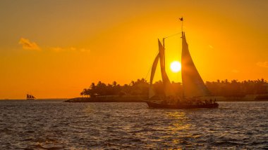 Sailing boat with tourists at sunset in the Key West, Florida
