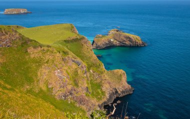 This vantage point, located on the Causeway Coastal Route in Northen Ireland, looks out over several islands namely, Rathelin, Carrick-a-Rede and Sheep Island.