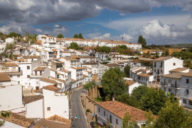 Exposure of Setenil de las Bodegas famous for its dwellings built into rock overhangs above the Rio Guadalporcn, Cadiz, Spain