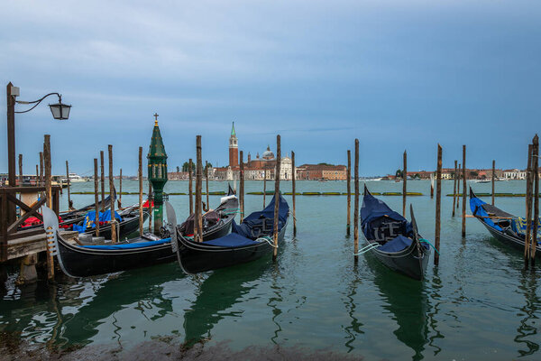 Exposure Exposure of the Gondolas in Venice with the Abbazia in the background, on a sunshiny day showing the pretty views of this magnificent city.