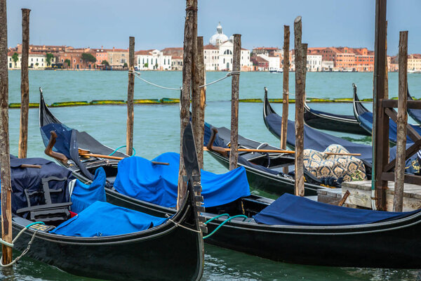 Exposure Exposure of the Gondolas in Venice with the Abbazia in the background, on a sunshiny day showing the pretty views of this magnificent city.