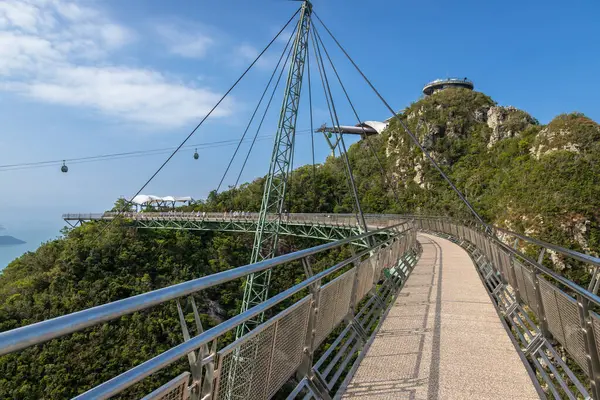 stock image Exposure of Langkawi Sky Bridge, that provides amazing views for pedestrian as it passes through the mountain peaks, it is the world's longest curse suspension bridge, Malaysia.