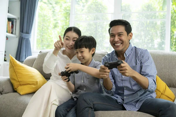Entertain technology family lifestyle, playing game online with fun and excited,cheering greeting victory together at home