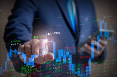 Businessman touching virtual screen with stock market changes, business candlestick chart. Investing. Number of rising candlesticks. online trading.businessman pointing arrow graph future company. 