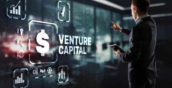 Venture capital. Investor capital. Businessman pressing virtual screen inscription.