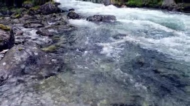 Beautiful river in wild nature of Norway near Aenes, slow motion