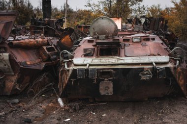 War in Ukraine, cemetery of destroyed equipment, destroyed military equipment, Izyum city, Kharkiv region clipart