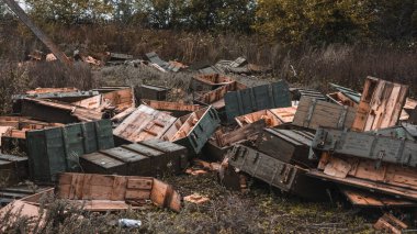 War in Ukraine, artillery position, artillery boxes, empty ammunition boxes. Kamyanka, Kharkiv region